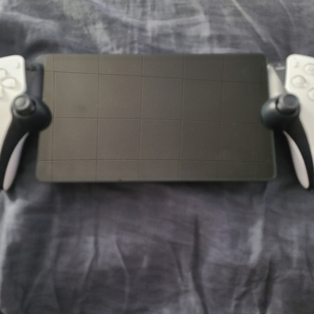 Sony Handheld Console with Black and White Controllers